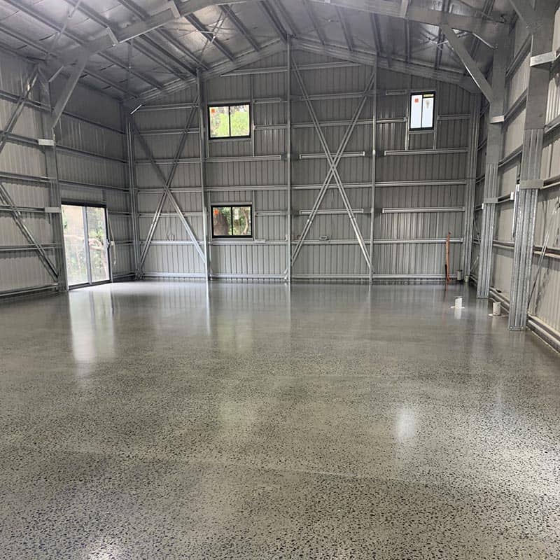 after photo of a shed with concrete grind and seal flooring