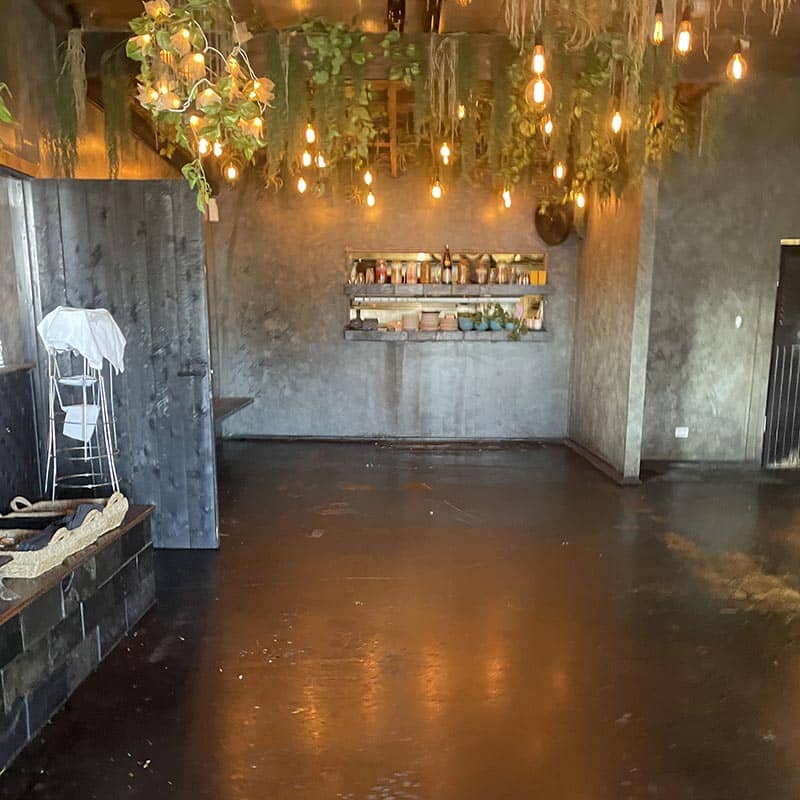 photo of a kitchen floor before grind and seal application